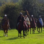 Norman knights led by Bishop Odo of Bayeux, riding under the papal banner